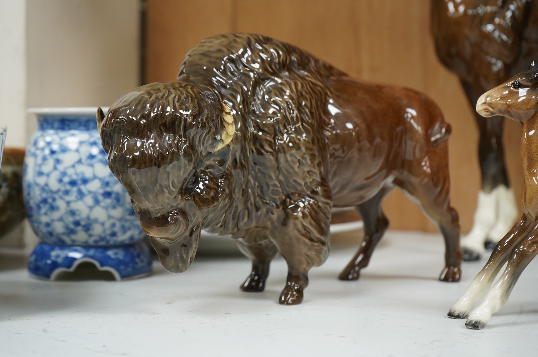 A Beswick large gloss glazed horse, a bison and a shire foal (3) tallest 29cm.